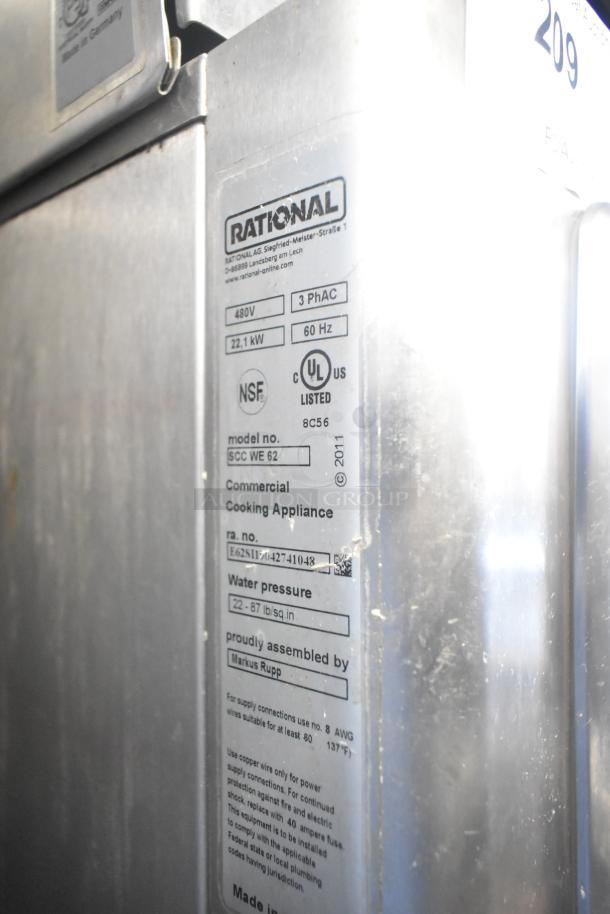 2019 Rational SCC WE 62 Self Cooking Center, stainless steel, 480V, 3-phase, door issue, with UltraVent hood, on double pan rack.
