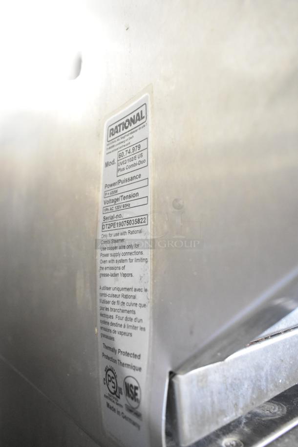 2019 Rational SCC WE 62 oven with UltraVent Plus hood on a stand. Stainless steel. Tag shows model 60.74.979. Door issue.