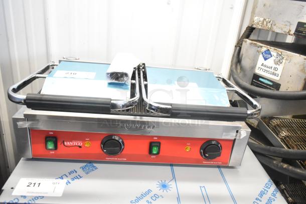 Brand new Avantco 177PG400 stainless steel dual panini grill with grooved plates, 19 5/8" x 9 1/8" cooking surface, 120V.