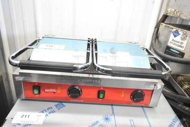 Brand new Avantco 177PG400 dual panini grill, stainless steel, grooved plates, 19 5/8" x 9 1/8" surface, 120V.