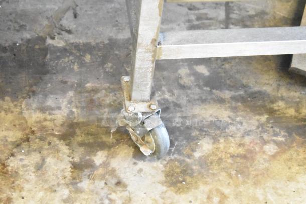 Commercial caster wheel of a 2016 Turbochef HhC2020 conveyor oven, showing sturdy metal construction and mobility.