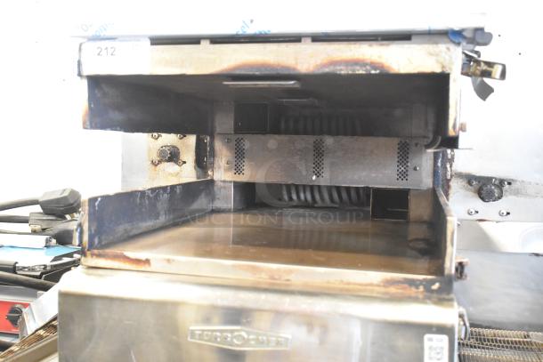 Turbochef HhC2020 stainless steel commercial conveyor oven, showing interior. Model label visible. Electric, on casters.