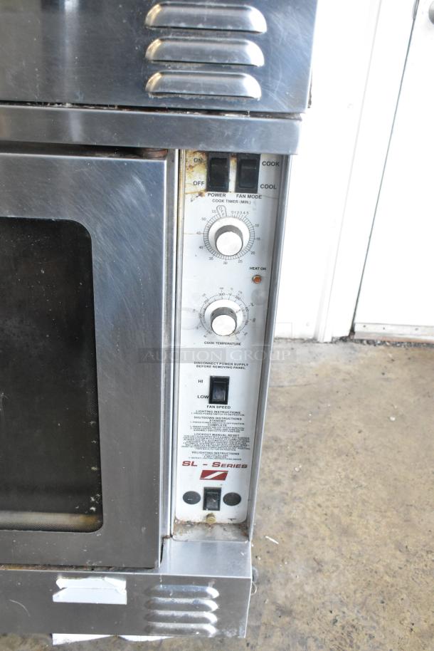 Southbend SL Series stainless steel convection oven with view-through doors and thermostatic controls. Mounted on commercial casters.