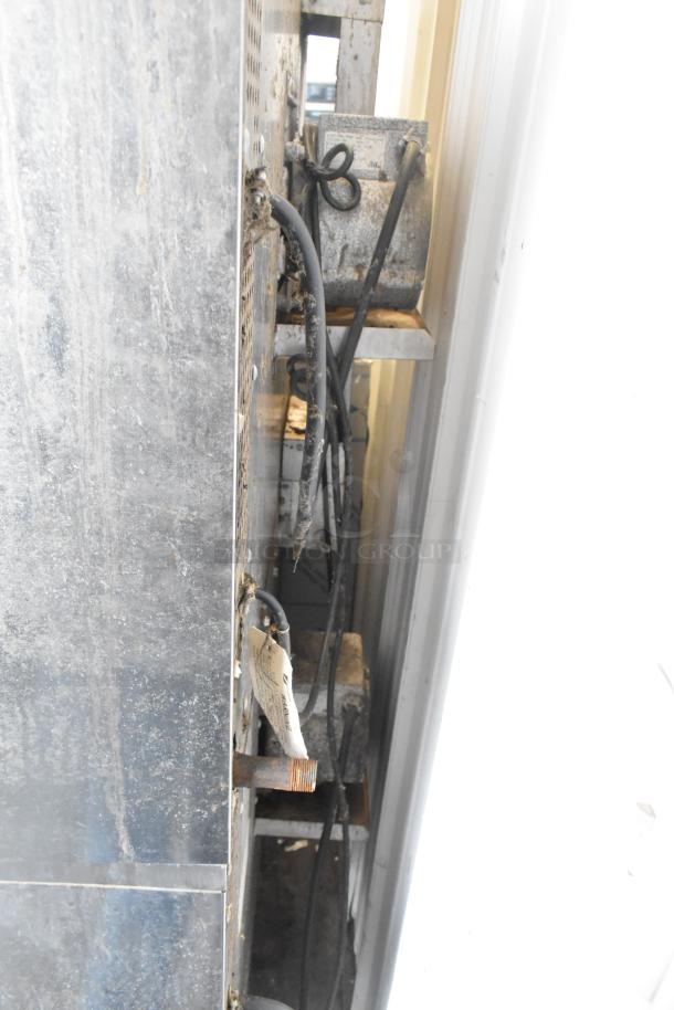 Southbend SL Series commercial convection oven; stainless steel, view-through doors, thermostatic controls, on casters.