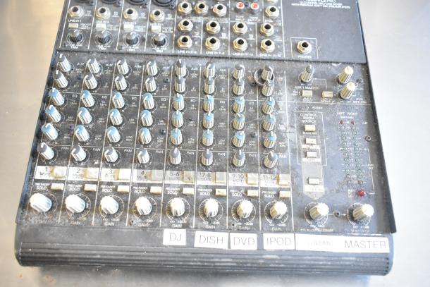 Mackie 1202-VLZ Pro 12-channel mic/line mixer. Features include 12 inputs, level controls, and labeled channels: DJ, DISH, DVD, iPOD. Used condition with surface wear.