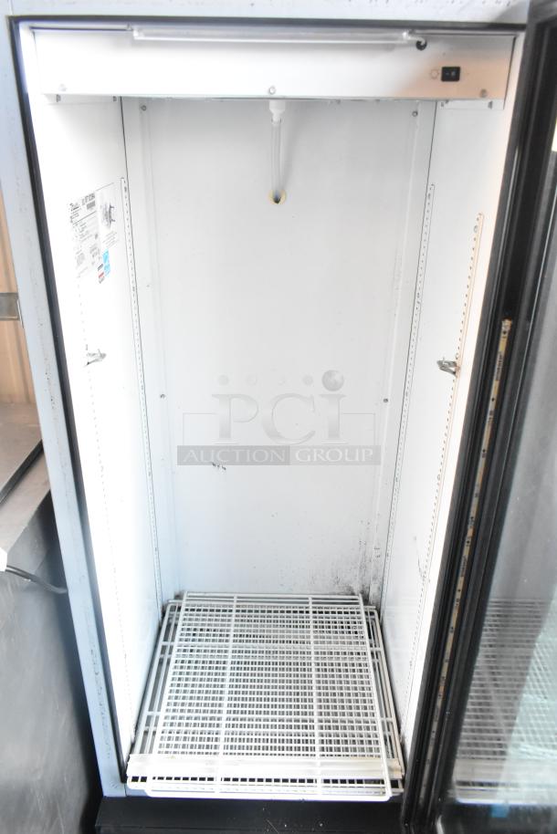 2016 True GDM-12-LD single door merchandiser cooler, metal interior, 115V, 1 phase. Visible wear, commercial use.