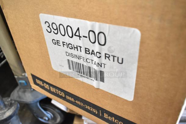 Box labeled "39004-00 GE Fight Bac RTU Disinfectant" from Betco, part of a lot including Betco Skin Cleanser and Coastwide cleaners.