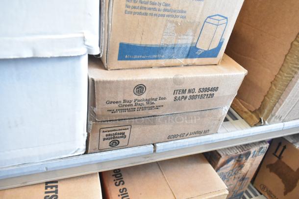 Tiered lot of various boxed items including Rubbermaid Auto Foam Refills, Aqua Sparkle Detergent, and Dymo Label Printer.