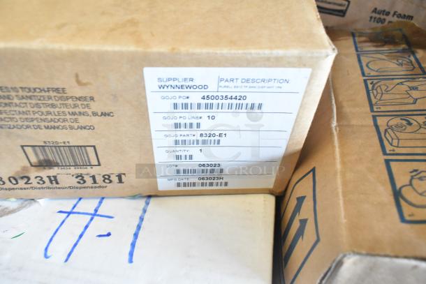 Auction item lot with Rubbermaid Auto Foam refills, Aqua Sparkle detergent, Dymo label printer. Visible labels include Gojo part info.