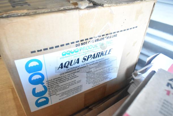 Cardboard box labeled "Aqua Sparkle Detergent for Machine Washing," with branding "Aqua Products, Inc." and product details.