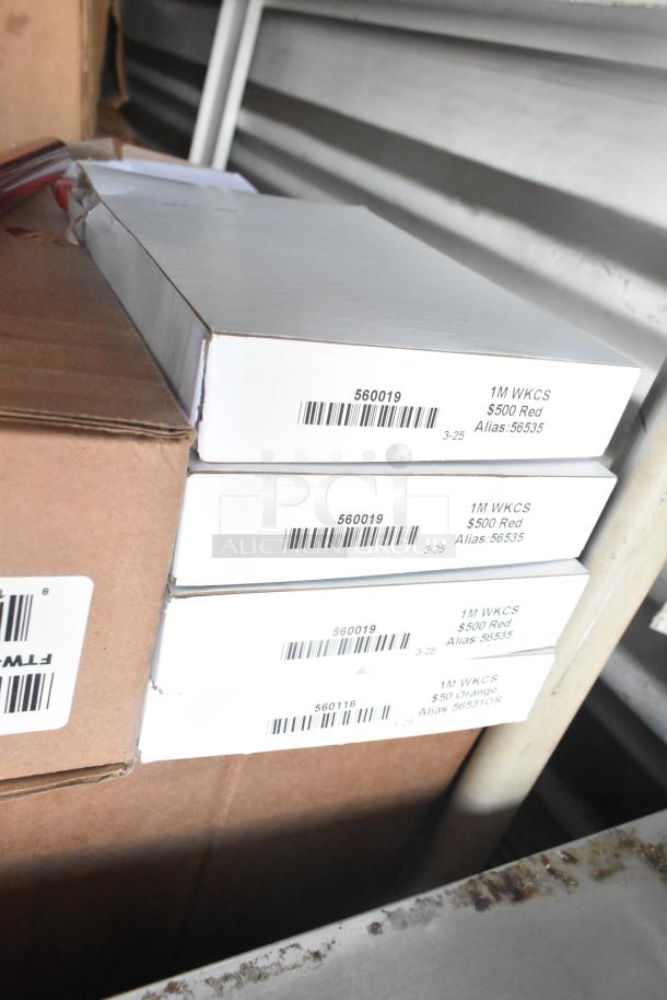 Auction item lot includes Rubbermaid Auto Foam refills, Aqua Sparkle detergent, and a Dymo label printer. Boxes labeled with product codes.