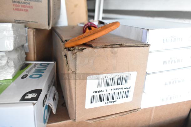 Tiered lot with Rubbermaid Auto Foam refills, Aqua Sparkle detergent, Dymo label printer, and various other items. Boxes show labels and barcodes.