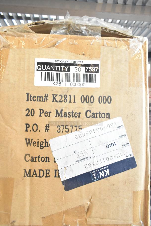 Cardboard box with labels indicating K2811 000 000, 20 per master carton, P.O. #375775, and "Made in" text. Worn condition.