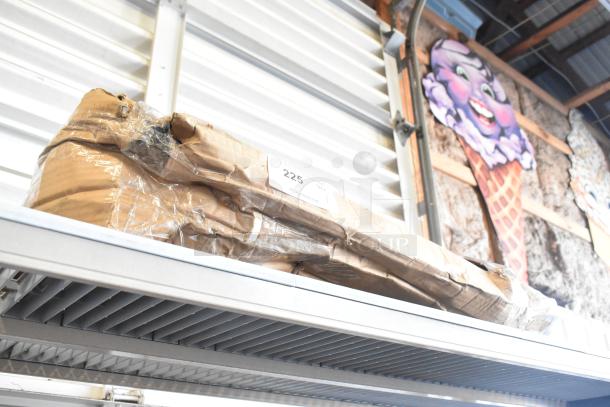 Brand new Regency 24" wall mounting bracket for black epoxy wire shelving, in scratch and dent condition, boxed with label.