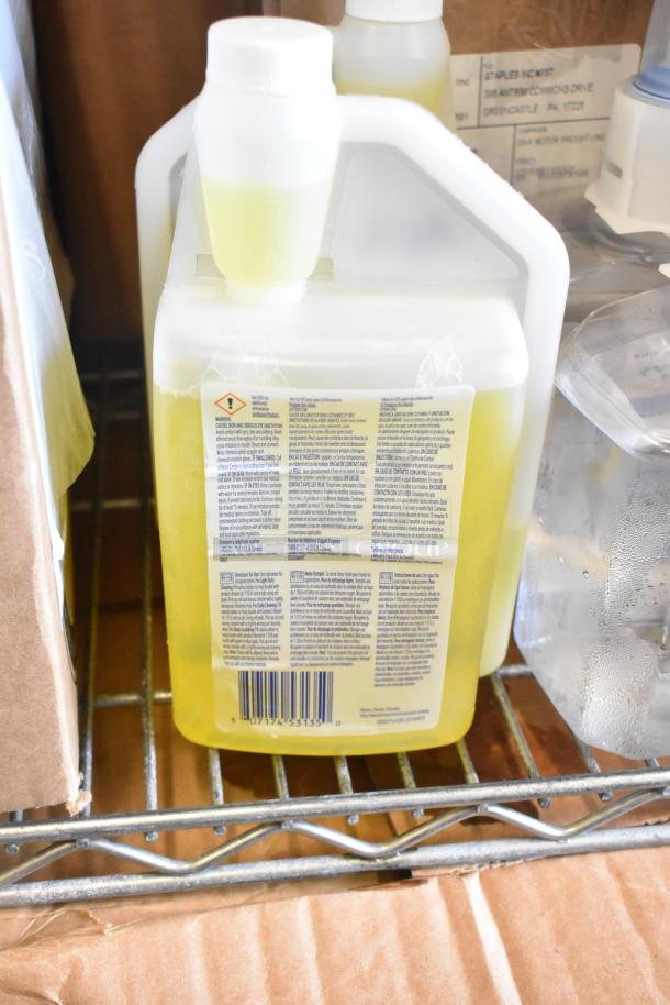 Two-tier lot with Coastwide glass cleaner, filters, and pH neutral floor cleaner. Bottles on metal rack, detailed labels.