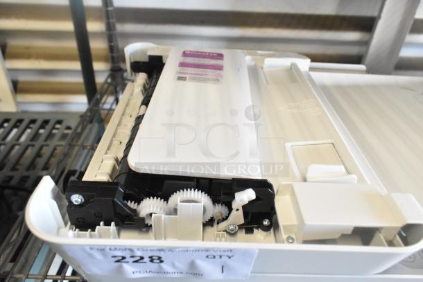 HP DeskJet 4255e printer/copier/scanner, white, visible interior with gears, label on top, auction ID tag attached.