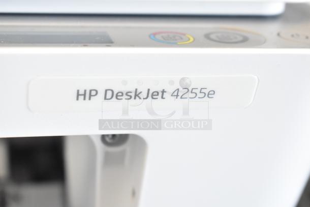 HP DeskJet 4255e multifunction printer with visible label, showing logo and model. Features print, scan, copy.