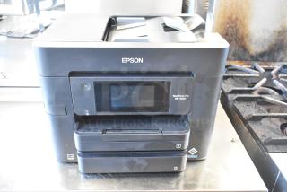Epson WF-4830 Wireless All-in-One Inkjet Printer, featuring a touchscreen display, dual paper trays, in used condition.