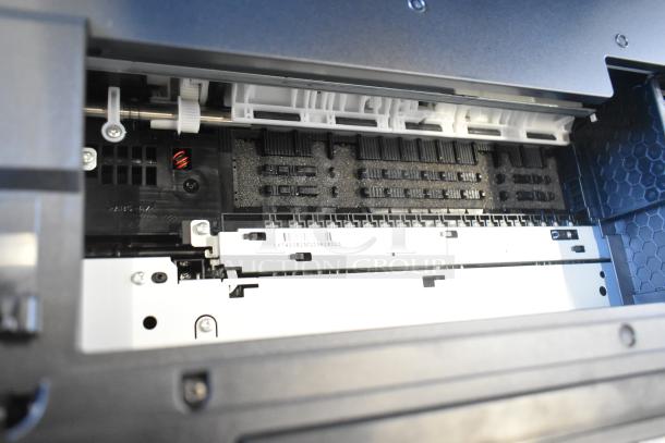 Epson WF-4830 printer interior showing clean and intact components, barcode visible. Suitable for wireless, all-in-one tasks.