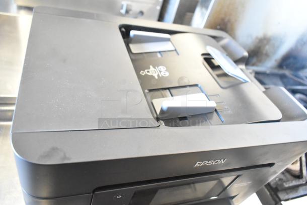 Epson WF-4830 Wireless All-in-One Inkjet Printer, black, visible paper tray, minimal wear, logo on front.