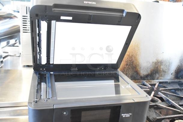 Epson WF-4830 Wireless All-in-One Inkjet Printer, open lid, clear glass scanner, black, in good condition.