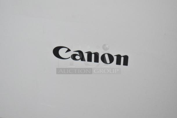 Canon F814500 printer scanner copier, countertop model, in good condition. Visible black Canon logo on white surface.