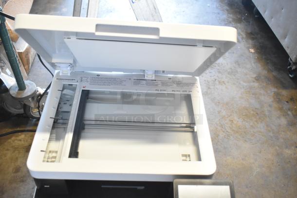 Canon F814500 countertop printer scanner copier, open lid, excellent condition, shows scanning bed and internal components.