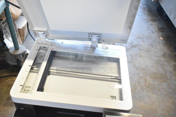 Canon F814500 countertop printer scanner copier, open lid, good condition, visible control panel and scanning bed.