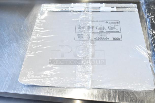 Lot of Acco binders in original packaging, sealed with clear wrap, featuring assembly instructions on the cover.