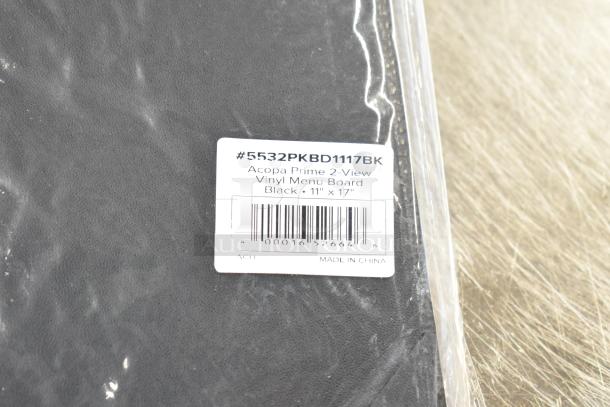 Lot of brown paper bags and Acco binders. Acopa Prime vinyl menu board label visible showing size and origin.