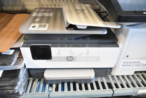 HP Countertop Printer Scanner Copier, white and gray, shows signs of use. HP logo on front. Model info on lid with QR code.