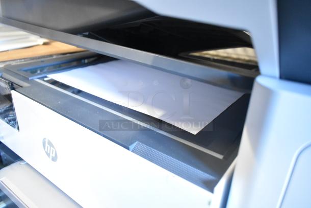 HP countertop printer scanner copier with visible paper tray, HP logo, and sleek design, in good condition.