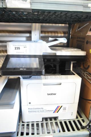 Brother MFC-L6810DW Countertop Printer, touchscreen, print, copy, scan, fax. Auction tag "235", good condition.