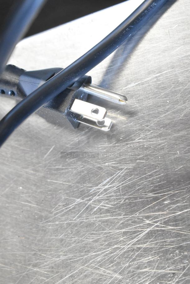 Stainless steel food warmer plug on a scratched metal surface, part of Server FSP model, 120V, 1 Phase.