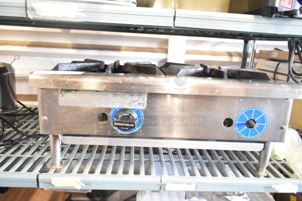 Rankin-Delux stainless steel 2-burner commercial gas range, countertop model, with control dials, used condition.