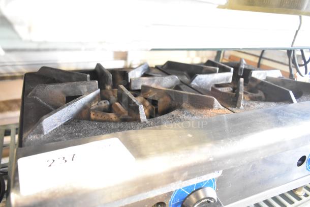 Rankin-Delux stainless steel 2 burner gas range, used condition, tags labeled "237," showing industrial design features.