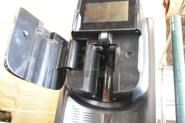 Flavia Creation 300 metal commercial coffee brewer, black, single-serve, countertop model. 120 volts, 1 phase, open compartment view.