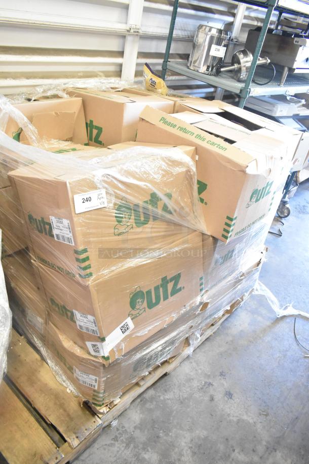 Boxes of Utz pumpernickel pretzel bags on a pallet, labeled "Please return this carton." 18 boxes available.