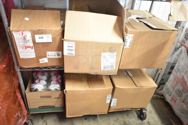 Two-tier lot of assorted items, including Clorox spray, in unopened cardboard boxes on a metal cart. Labels indicate contents and shipping info.