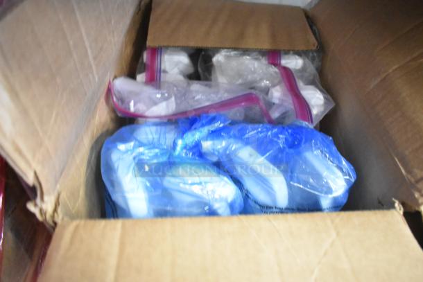 Cardboard box containing a two-tier lot of various items, including Clorox spray bottles, bags, and supplies in plastic packaging.