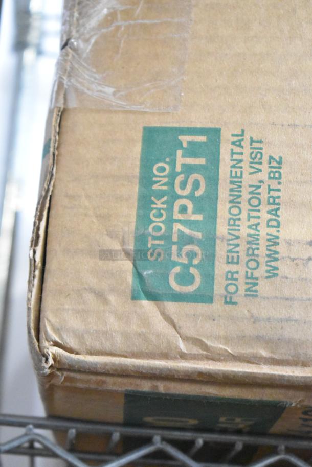 Cardboard box marked "Stock No. C57PST1" indicating a two-tier lot with large condiment bar and straws.