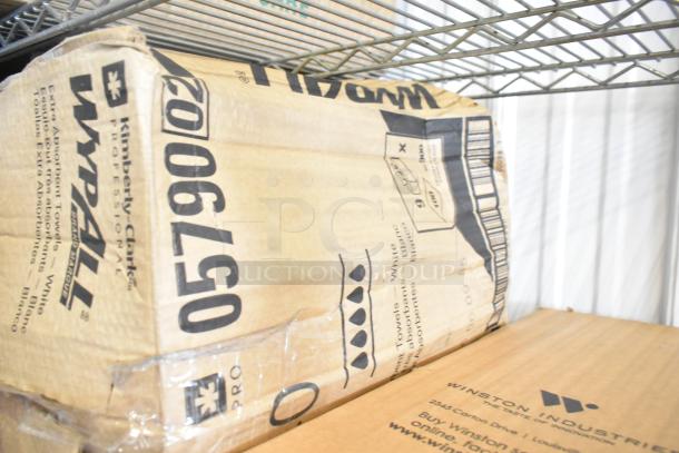 Two-tier shelf with Kimberly-Clark WypAll boxes, featuring large condiment bar and straws. Box text indicates towel contents.