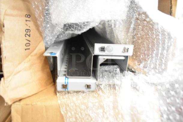 Two-tier lot with a large condiment bar and straws, partially wrapped in bubble wrap. Date marked: 10/29/18.