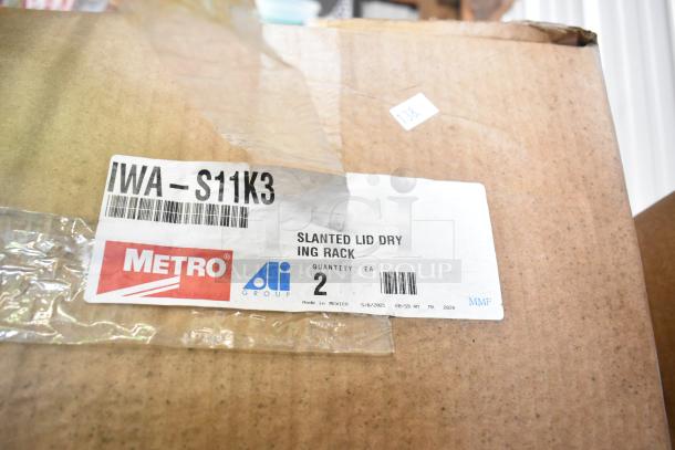 Box label showing "Metro IWA-S11K3 Slanted Lid Drying Rack." New condition with tags indicating quantity and manufacturing details.