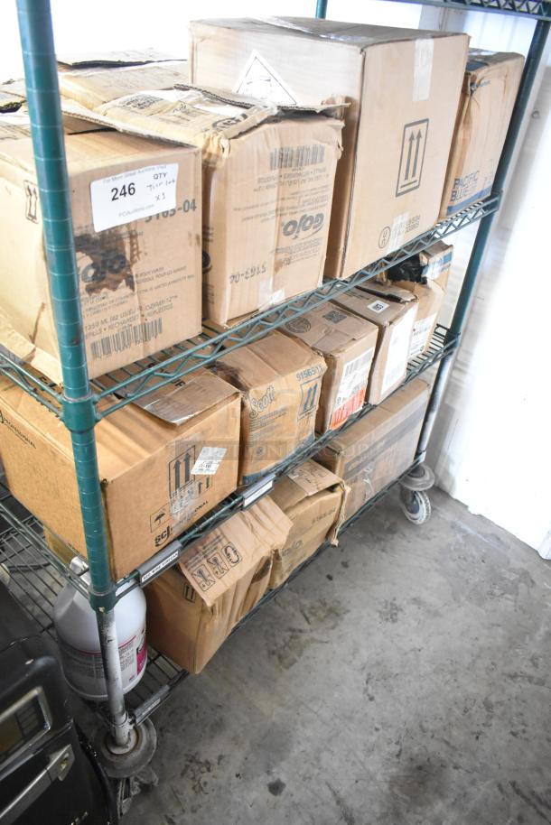 Three-tier lot of boxes on shelves, including Gojo Green Hand and Body Wash, Diversey Suma Detergent, showing shipping labels.