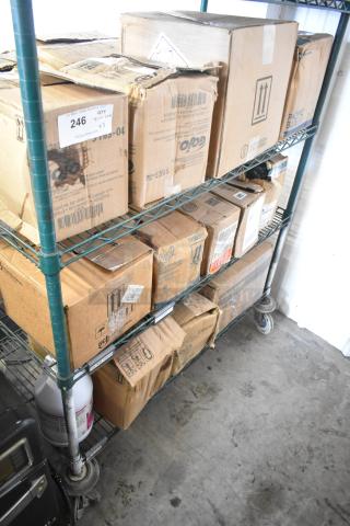 Three-tier lot of boxes on shelves, including Gojo Green Hand and Body Wash, Diversey Suma Detergent, showing shipping labels.