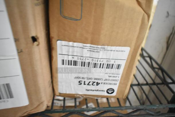 Three tier lot of various boxes, including Gojo Green Hand and Body Wash and Diversey Suma Blend Warewashing Detergent. Visible shipping labels.