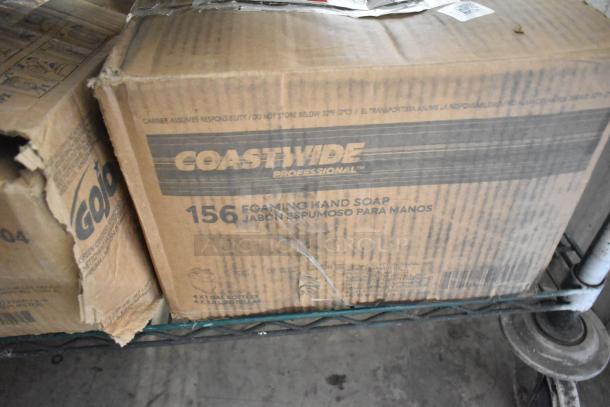 Three-tier lot of various boxes, including Gojo Green Hand and Body Wash and Diversey Suma Blend Detergent, on metal shelf.