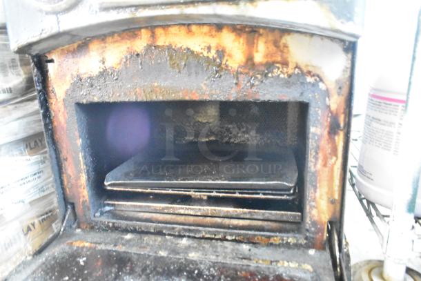 Turbochef NGO rapid cook oven interior, showing signs of heavy use with visible wear and grease buildup.