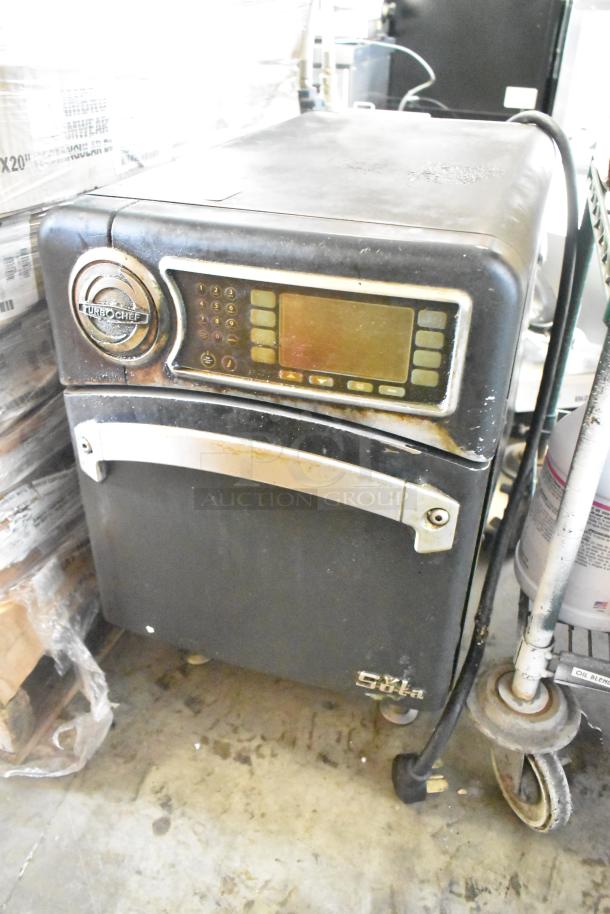 Turbochef NGO metal commercial countertop rapid cook oven, shows wear, 208/240V, 1 phase, digital controls, logo visible.
